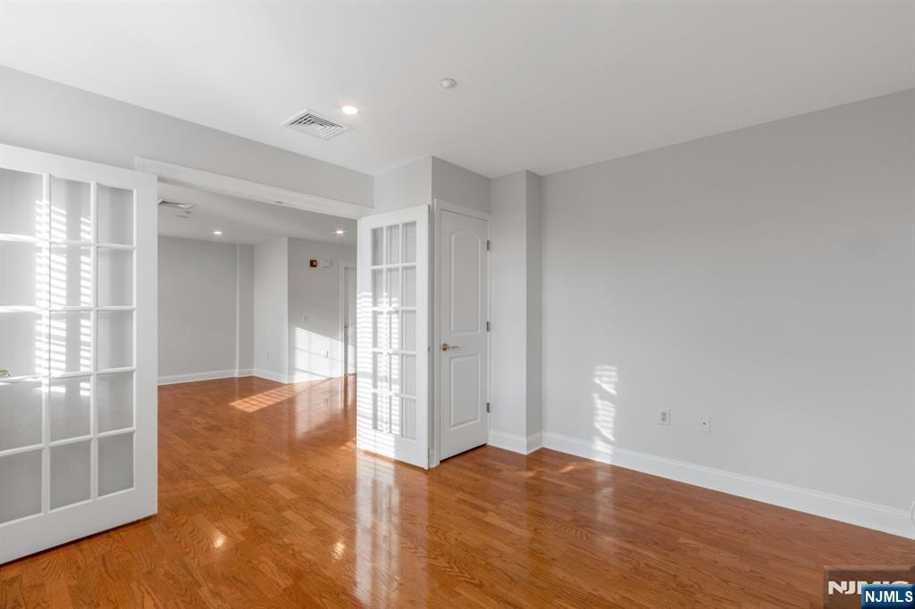 5401 Rio Vista Drive Mahwah, NJ 07430 - Photo 18 of 26 a view of an empty room with wooden floor and a window