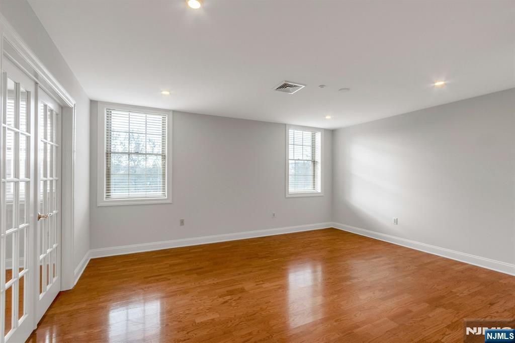 5401 Rio Vista Drive Mahwah, NJ 07430 - Photo 20 of 26 a view of an empty room with wooden floor and a window