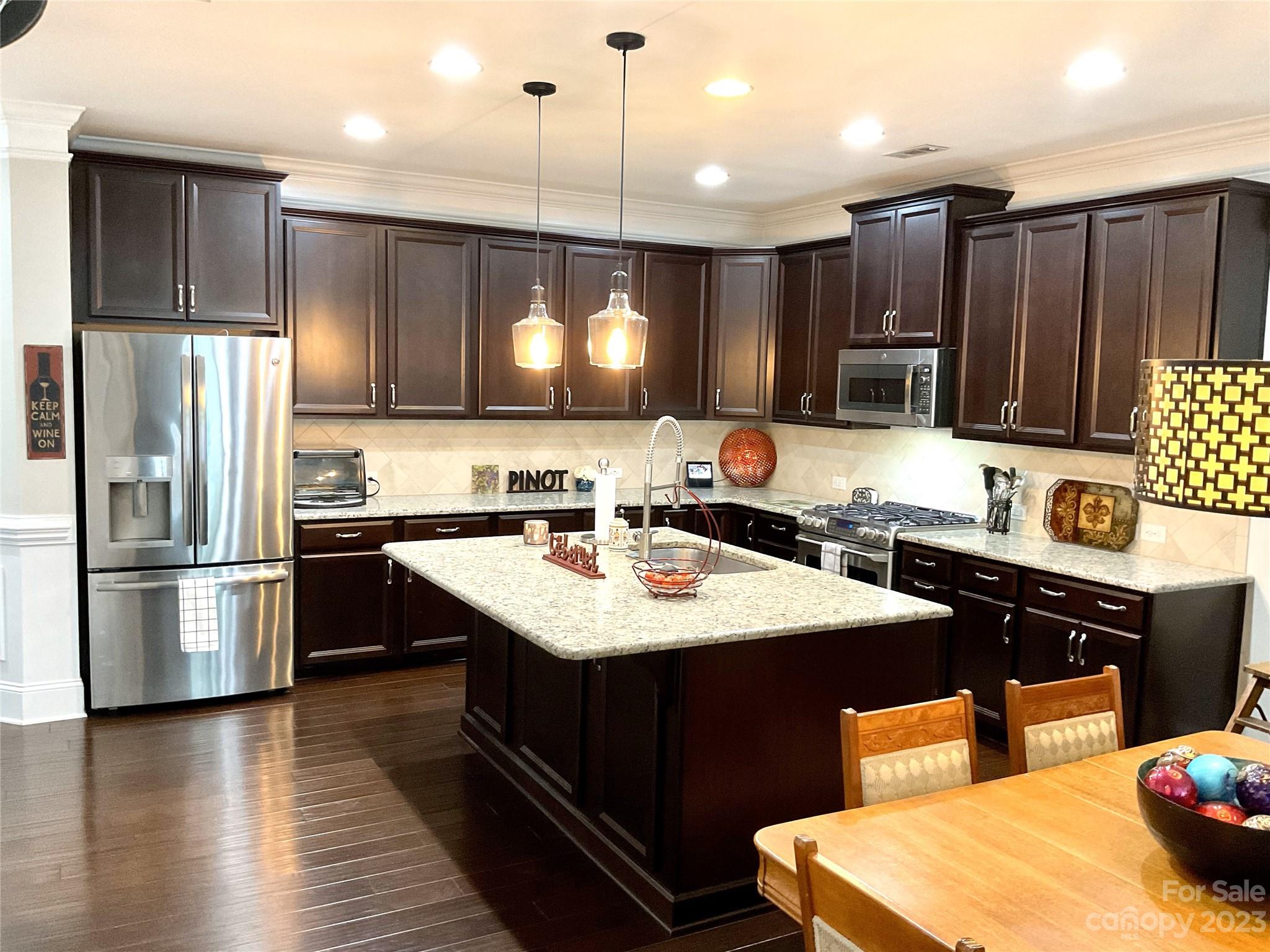 902 Ospre Lane Fort Mill, SC 29708 - Photo 11 of 44 a kitchen with a sink stove and refrigerator