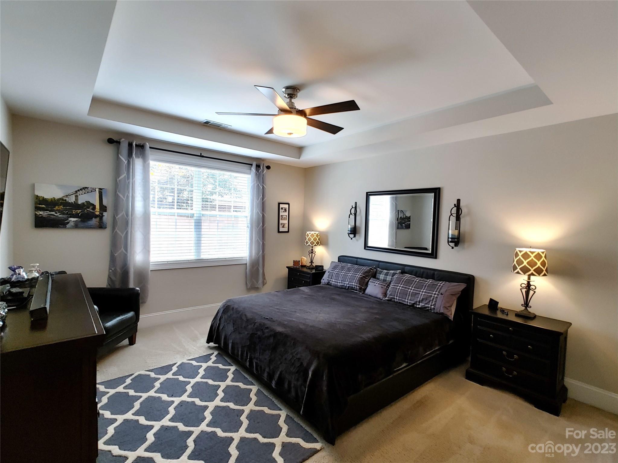 902 Ospre Lane Fort Mill, SC 29708 - Photo 18 of 44 a bedroom with double bed and a lamp