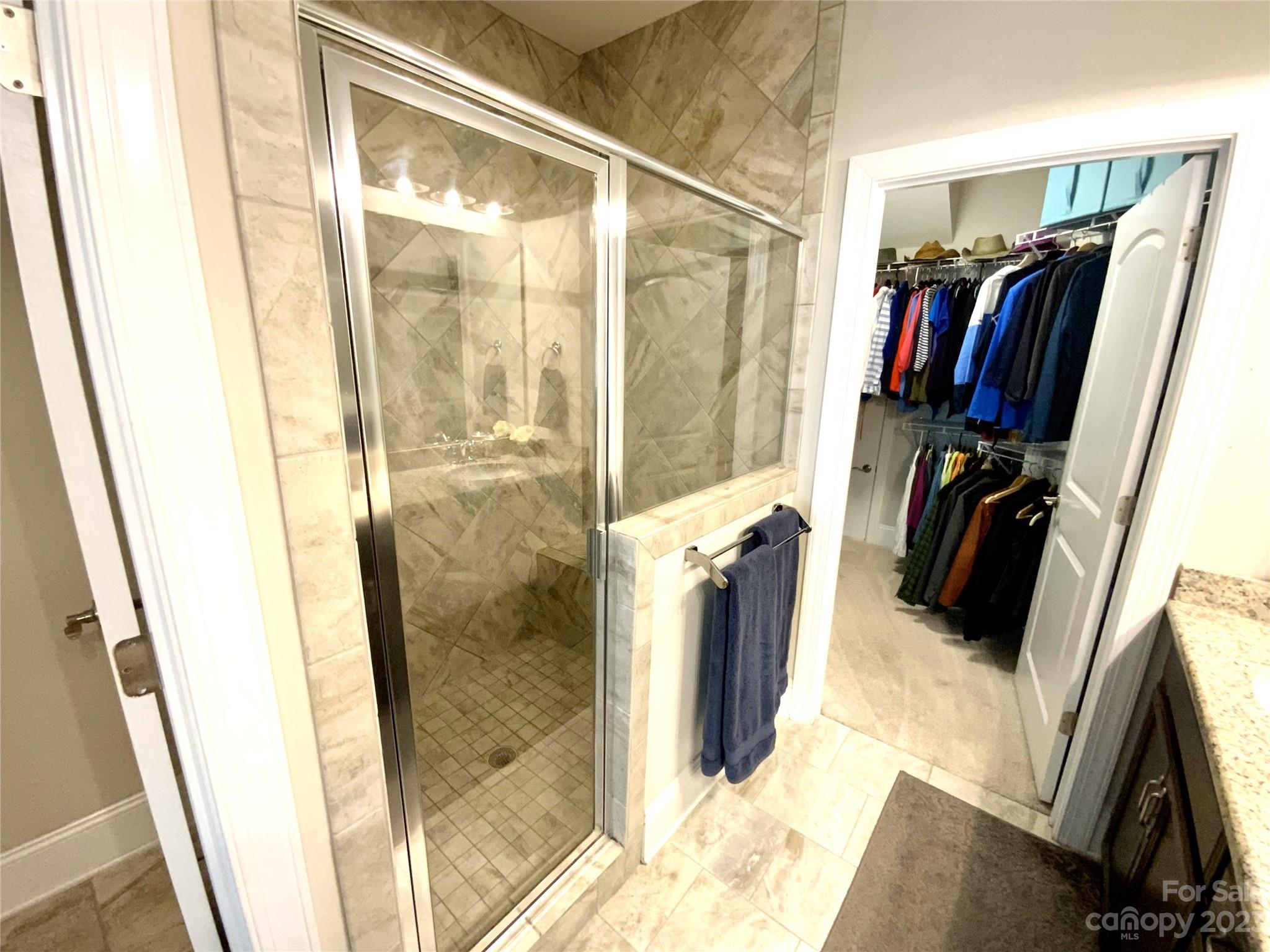 902 Ospre Lane Fort Mill, SC 29708 - Photo 21 of 44 a view of walk in closet with clothes and shoes
