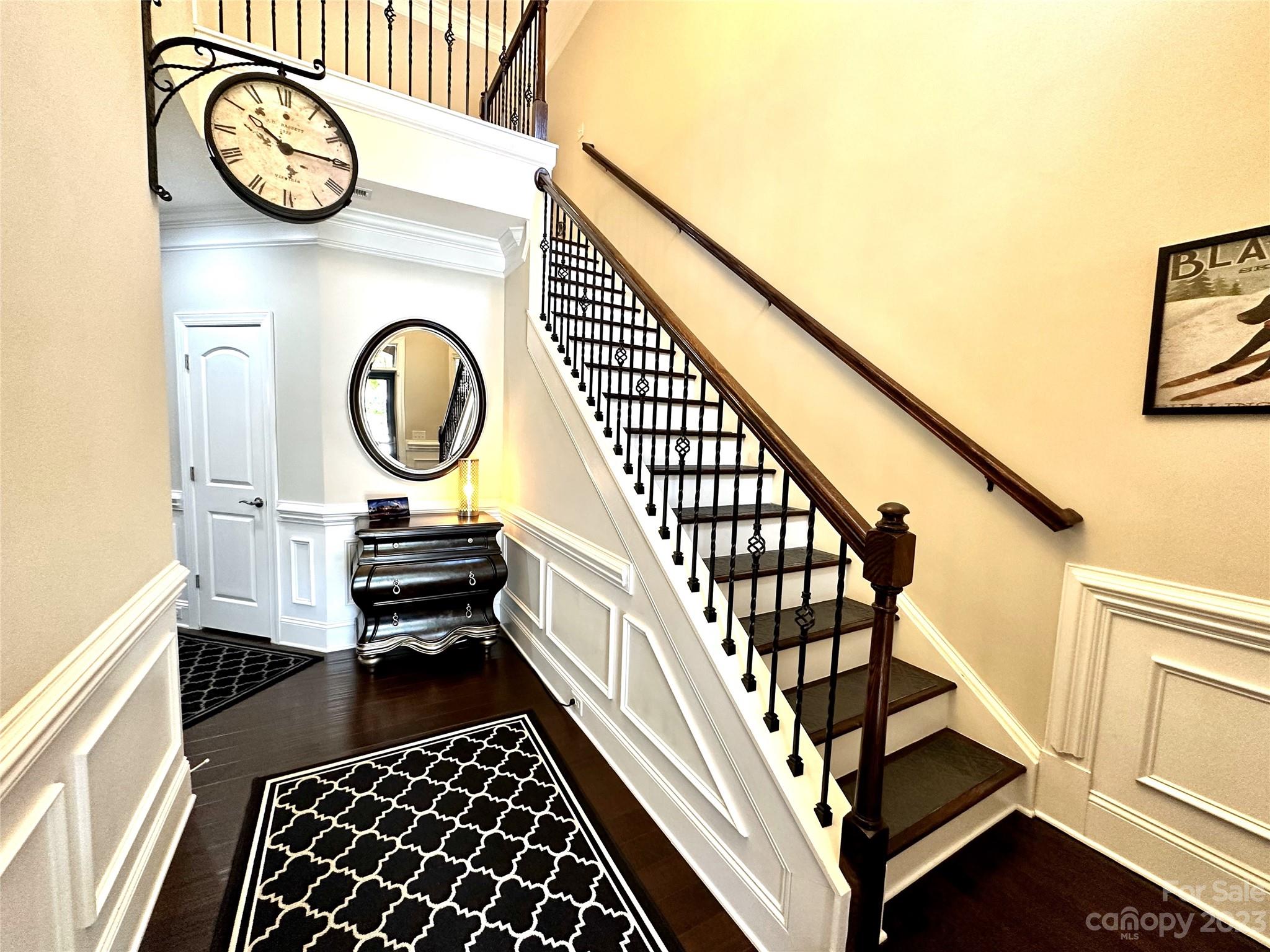 902 Ospre Lane Fort Mill, SC 29708 - Photo 3 of 44 a view of a hallway with wooden floor and staircase