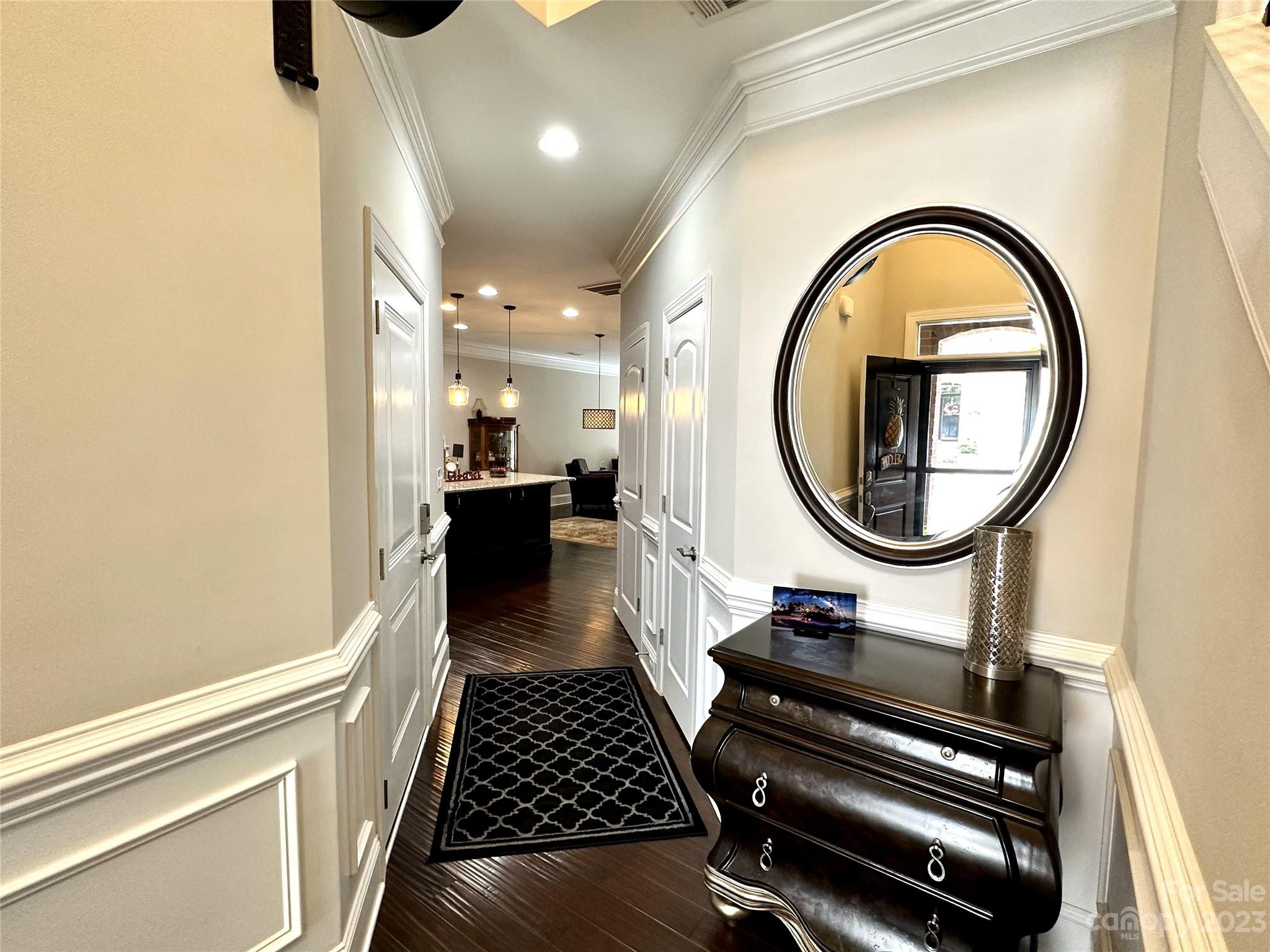 902 Ospre Lane Fort Mill, SC 29708 - Photo 5 of 44 a hallway with a stove a dining table and chair