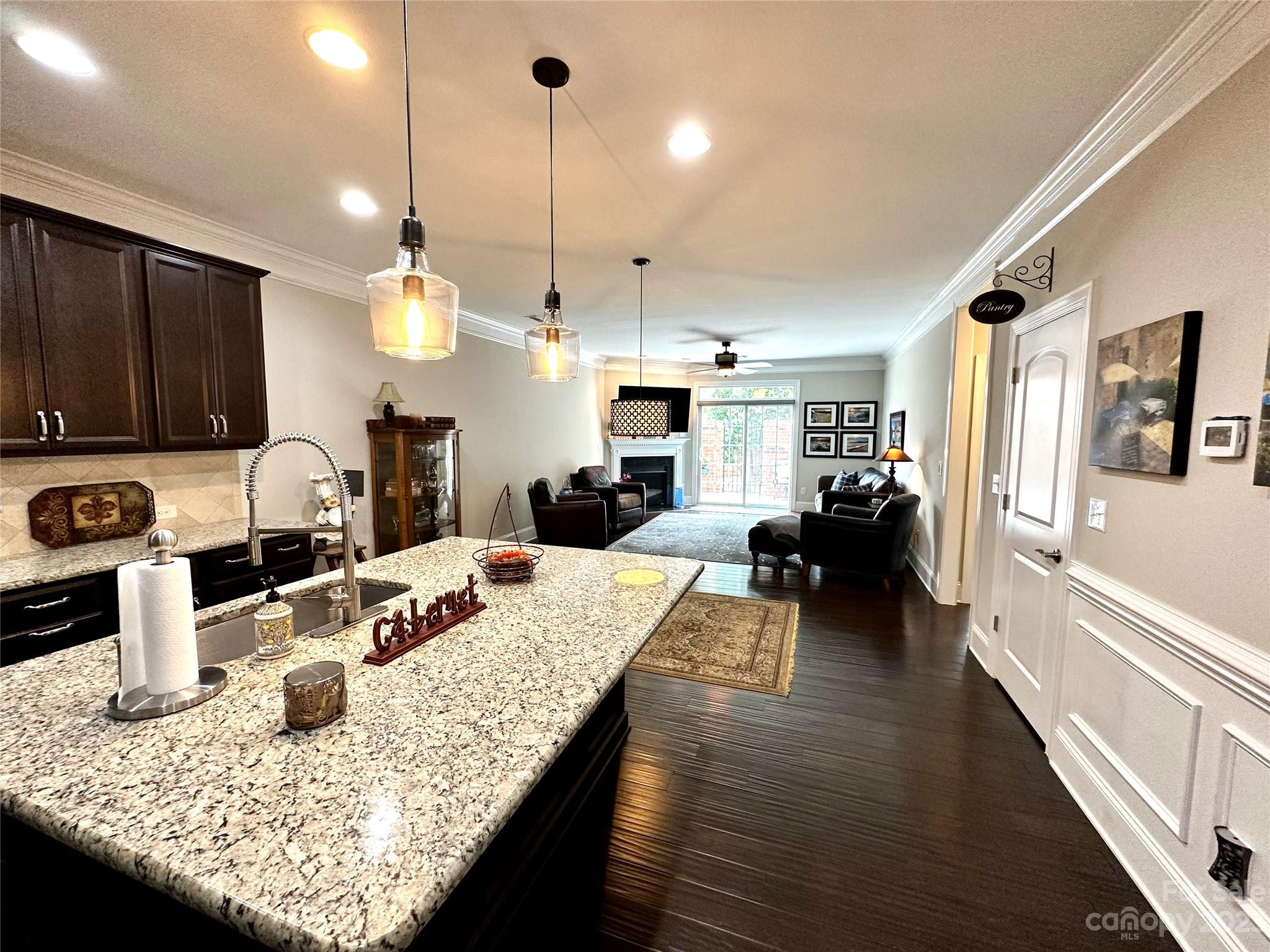 902 Ospre Lane Fort Mill, SC 29708 - Photo 9 of 44 a kitchen with sink refrigerator dining table and chairs