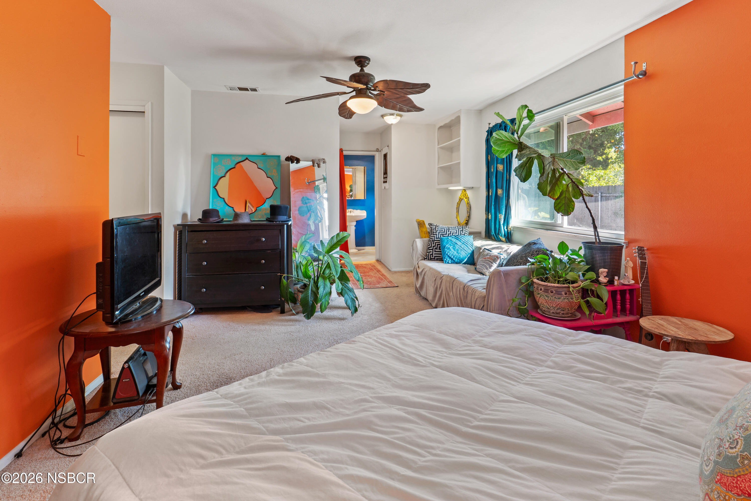 4220 Constellation Road Lompoc, CA 93436 - Photo 18 of 22 a bedroom with a bed and a chandelier