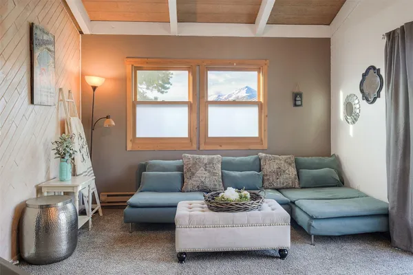 a living room with furniture and a window