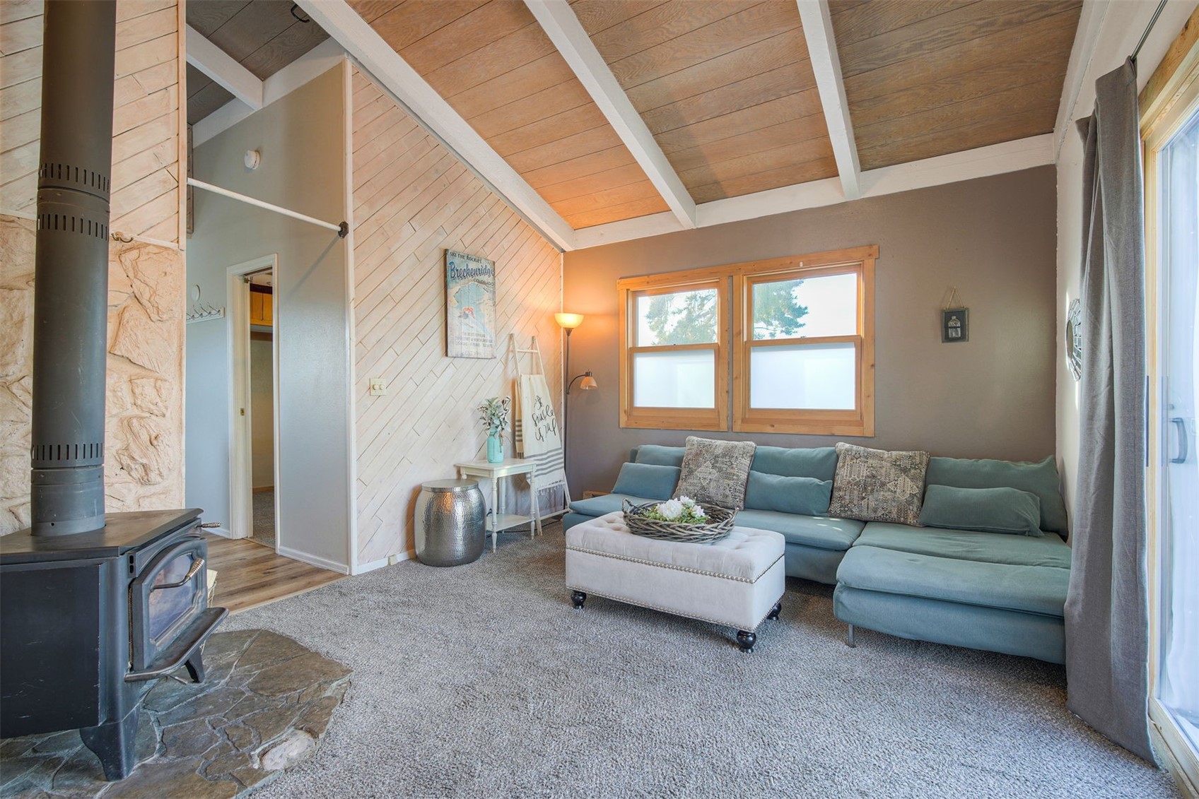 8018 Ryan Gulch Road, Unit B9 Silverthorne, CO 80498 - Photo 5 of 17 a living room with furniture and a window