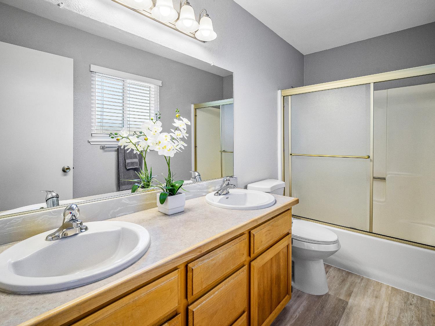 4914 Summit View Court El Dorado, CA 95623 - Photo 15 of 31 a bathroom with a granite countertop sink toilet and shower