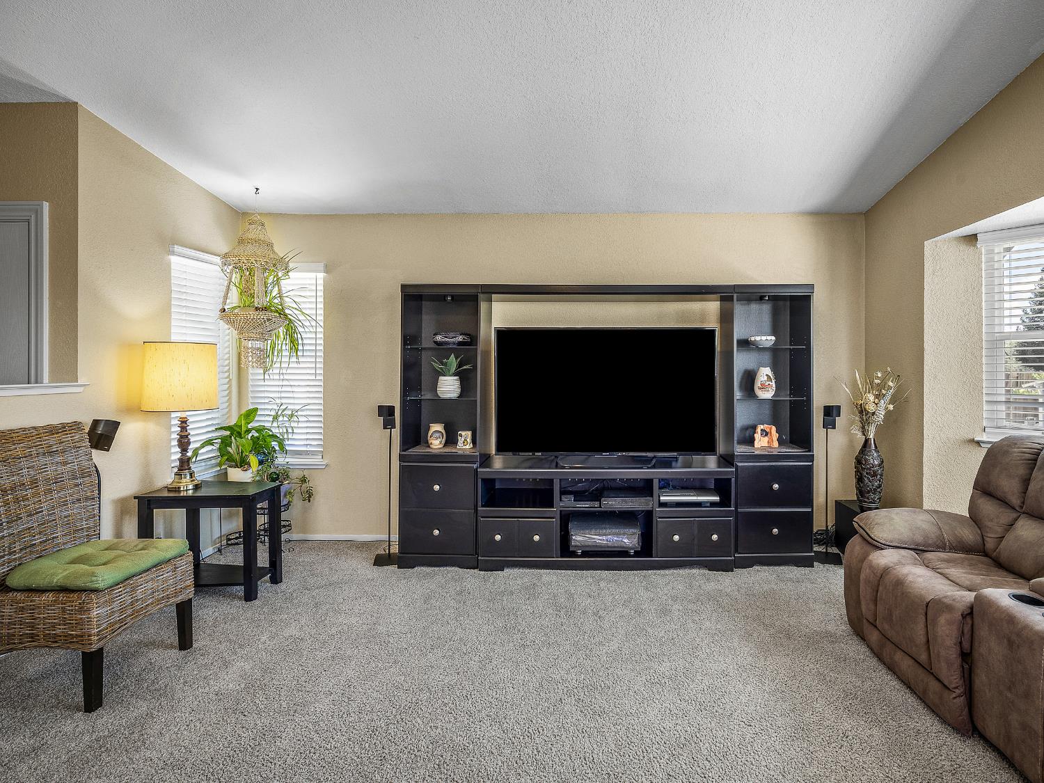 4914 Summit View Court El Dorado, CA 95623 - Photo 6 of 31 a living room with furniture and a flat screen tv