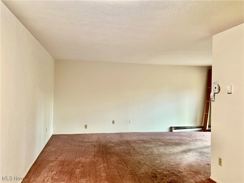3068 Kent Road, Unit 105C Stow, OH 44224 - Photo 6 of 42 Dining room leading to living room
