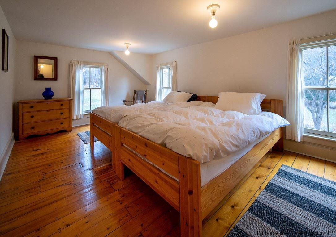 174 Peak Road Stone Ridge, NY 12484 - Photo 15 of 29 a bed sitting in a bedroom next to a window