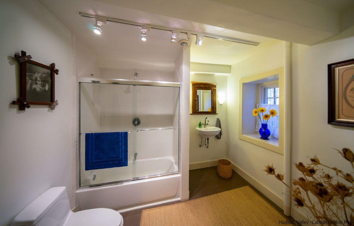 174 Peak Road Stone Ridge, NY 12484 - Photo 19 of 29 a bathroom with a tub and a shower