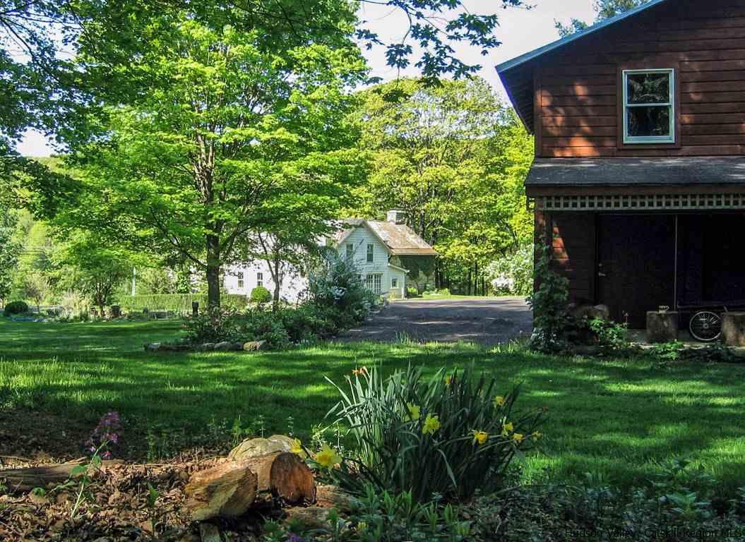 174 Peak Road Stone Ridge, NY 12484 - Photo 23 of 29 a front view of a house with garden