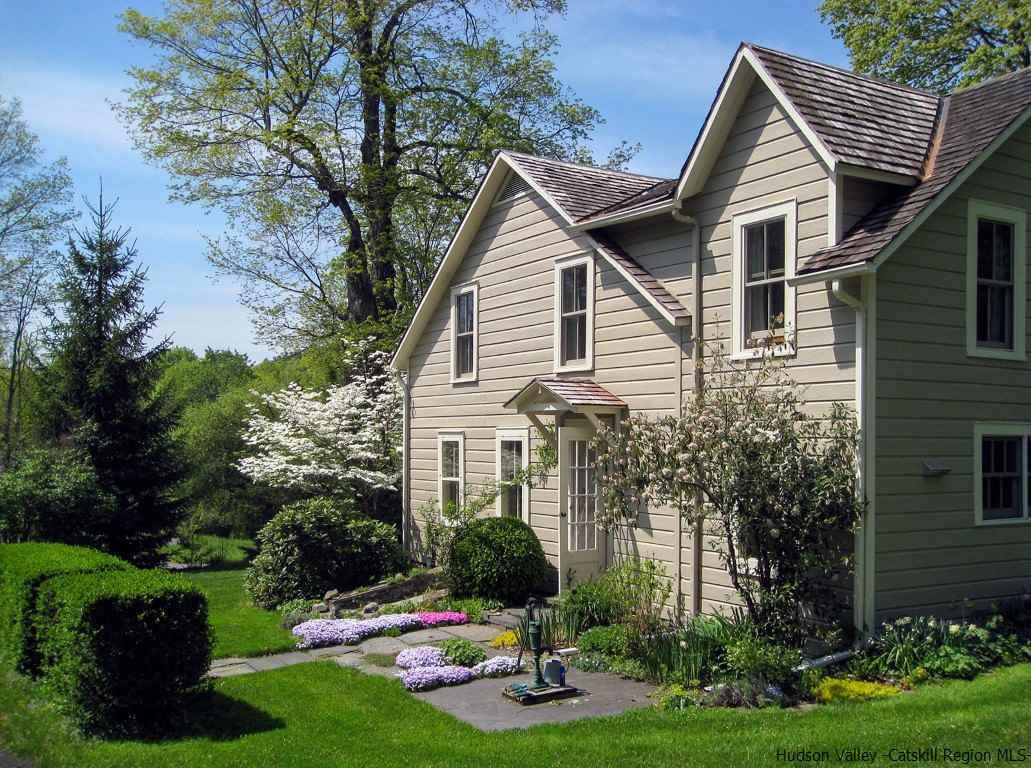 174 Peak Road Stone Ridge, NY 12484 - Photo 3 of 29 a front view of a house with a yard and garage