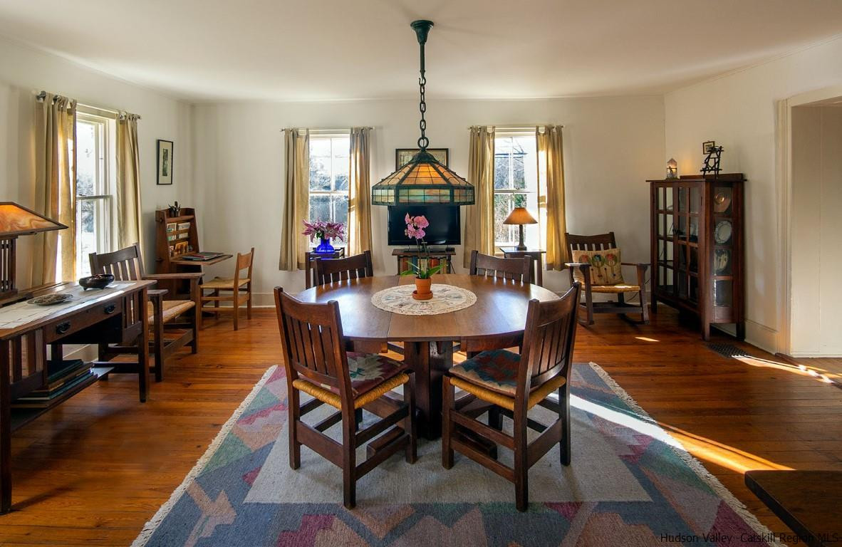 174 Peak Road Stone Ridge, NY 12484 - Photo 8 of 29 a dining room with furniture window and wooden floor