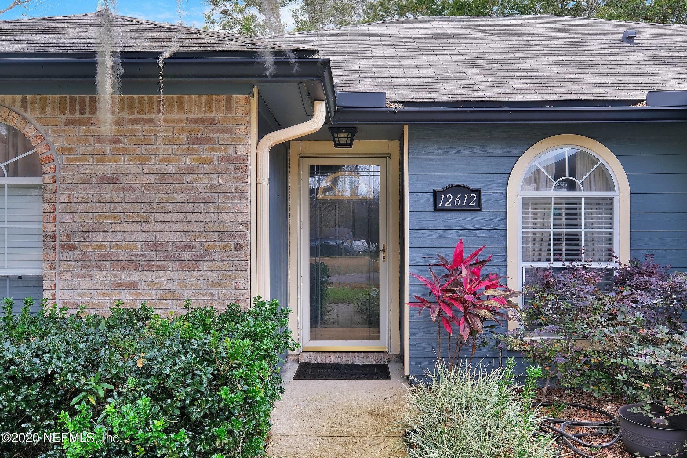12612 Moose Road Jacksonville, FL 32226 - Photo 3 of 28 a front view of a house with garden