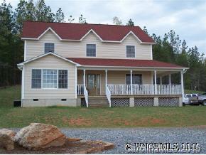 780 Meadow Crest Road Tryon, NC 28782 - Photo 1 of 12 front view of a house with a yard