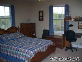 780 Meadow Crest Road Tryon, NC 28782 - Photo 11 of 12 a bedroom with a bed window and table