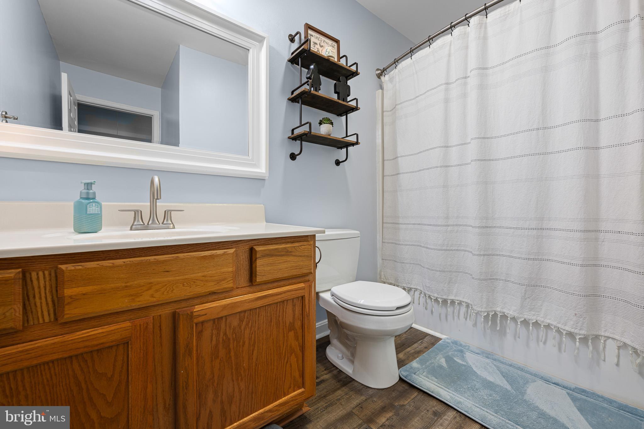 70 West Deer Trail Road Clayton, DE 19938 - Photo 15 of 25 a bathroom with a sink and a toilet