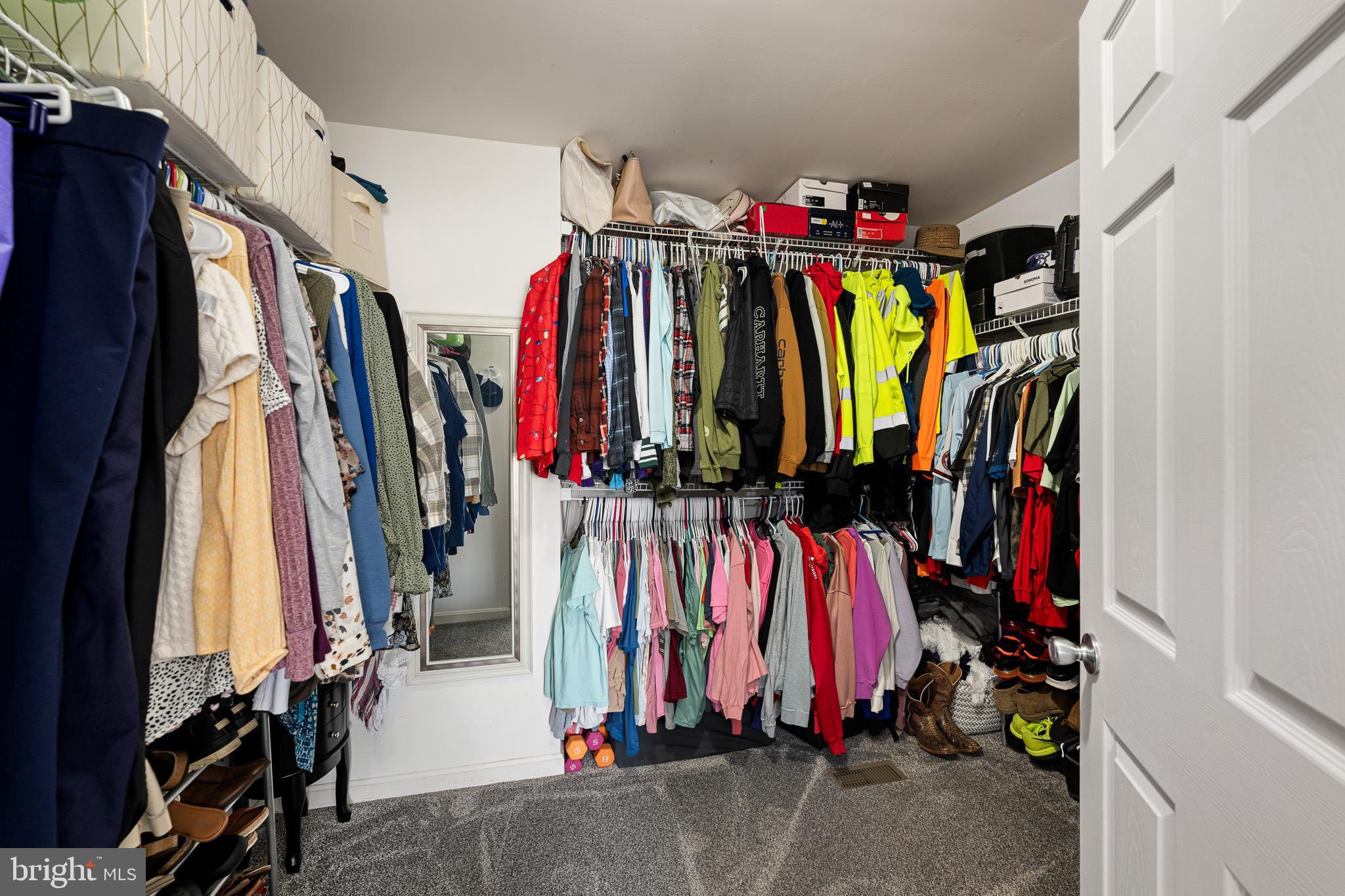 70 West Deer Trail Road Clayton, DE 19938 - Photo 17 of 25 a view of walk in closet with clothes