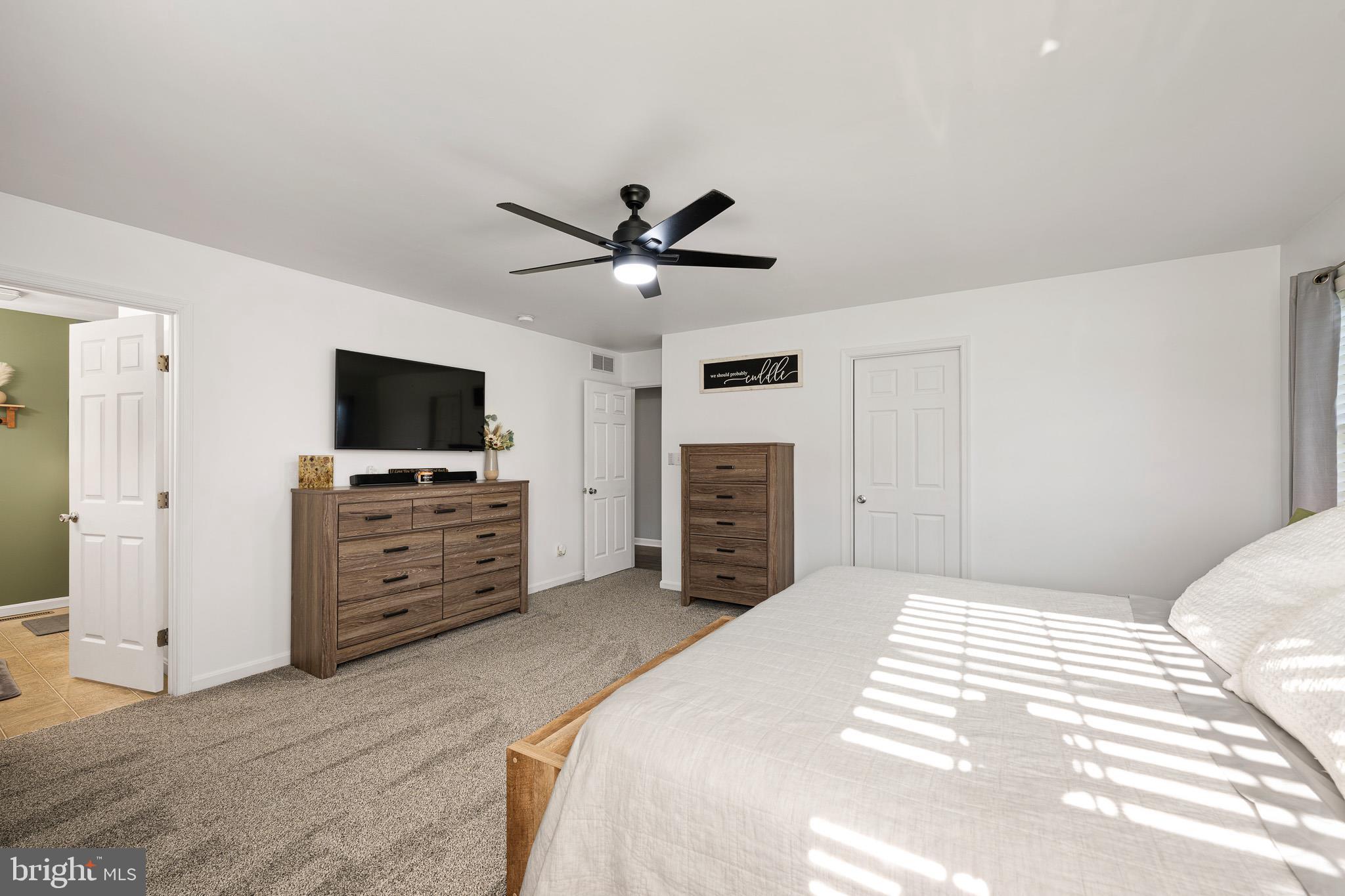 70 West Deer Trail Road Clayton, DE 19938 - Photo 18 of 25 a bedroom with a bed and a flat screen tv