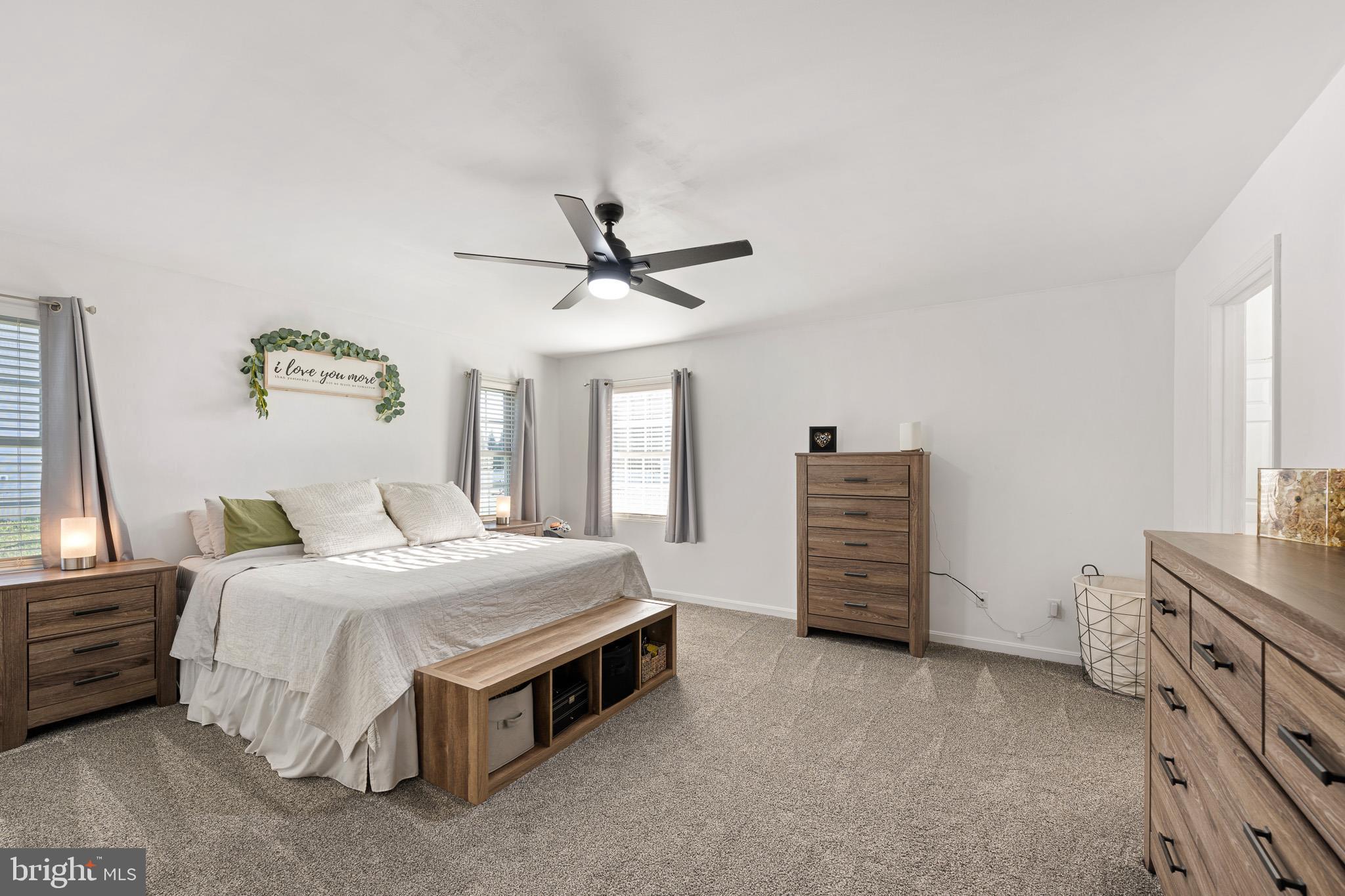 70 West Deer Trail Road Clayton, DE 19938 - Photo 19 of 25 a bedroom with a bed and a ceiling fan