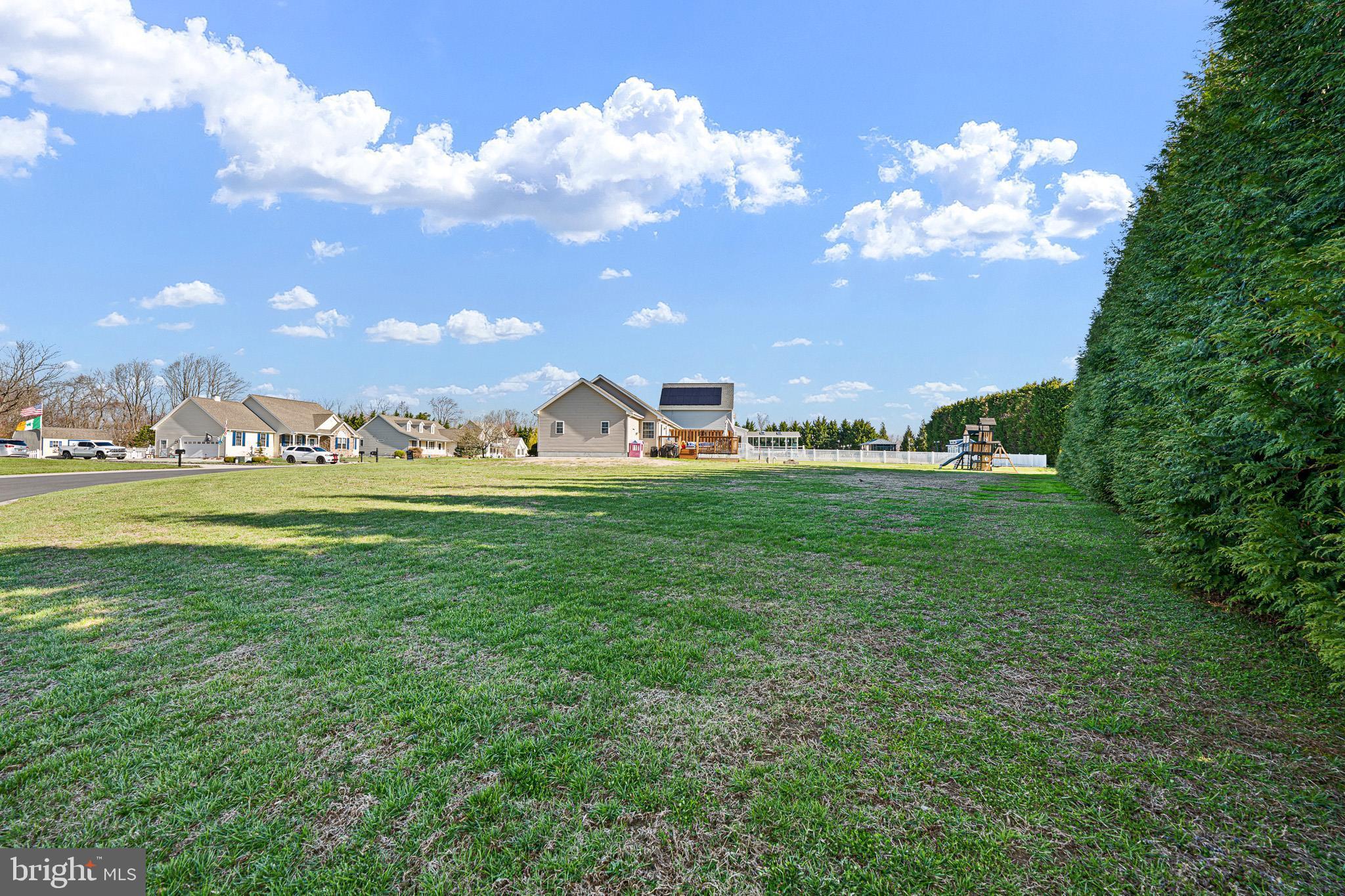 70 West Deer Trail Road Clayton, DE 19938 - Photo 2 of 25 a view of a playground with basketball court