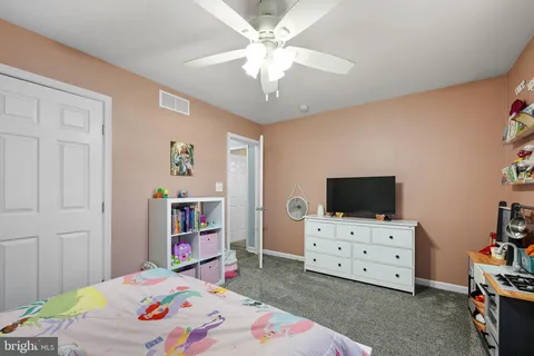 a bedroom with a bed and furniture