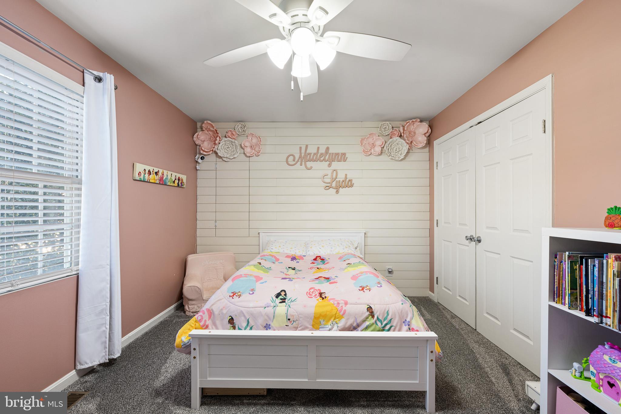 70 West Deer Trail Road Clayton, DE 19938 - Photo 22 of 25 a bedroom with a bed and a book shelf