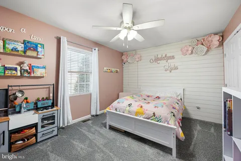 a bedroom with a bed and cabinets