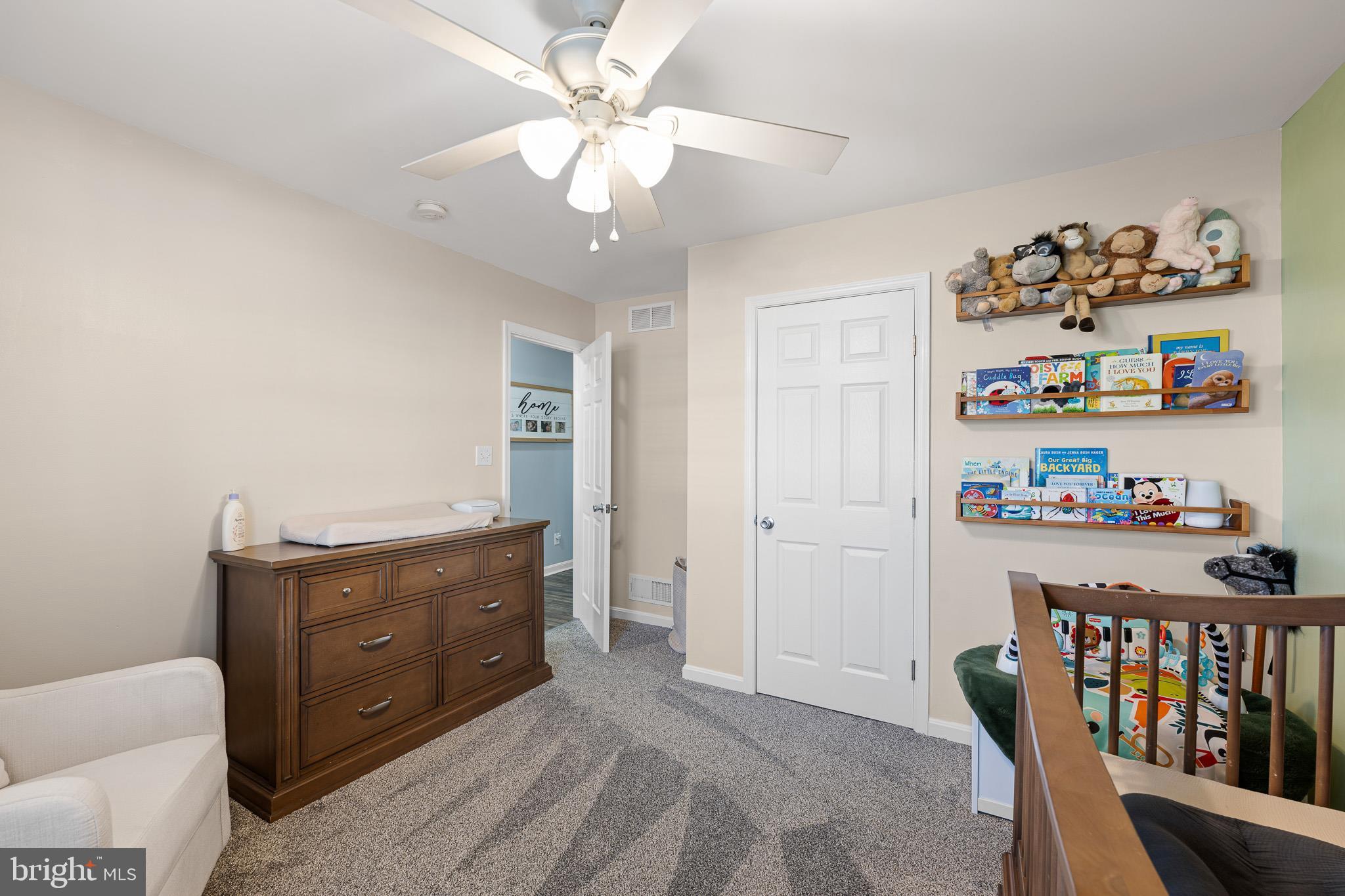 70 West Deer Trail Road Clayton, DE 19938 - Photo 24 of 25 a room with a baby crib and a dresser