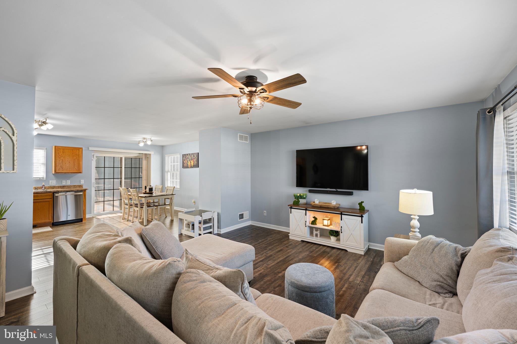 70 West Deer Trail Road Clayton, DE 19938 - Photo 8 of 25 a living room with furniture and a flat screen tv
