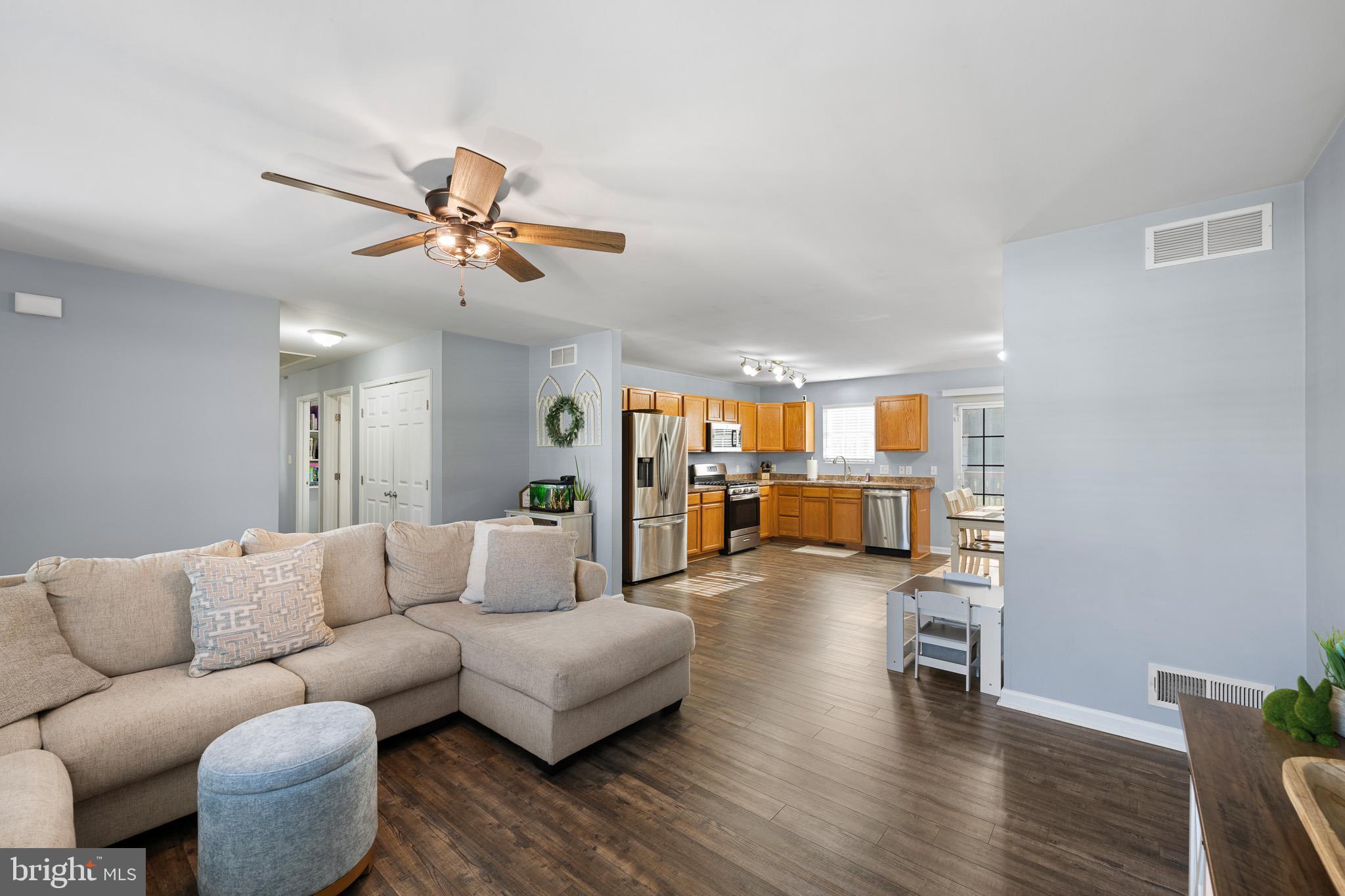 70 West Deer Trail Road Clayton, DE 19938 - Photo 9 of 25 a living room with furniture and wooden floor