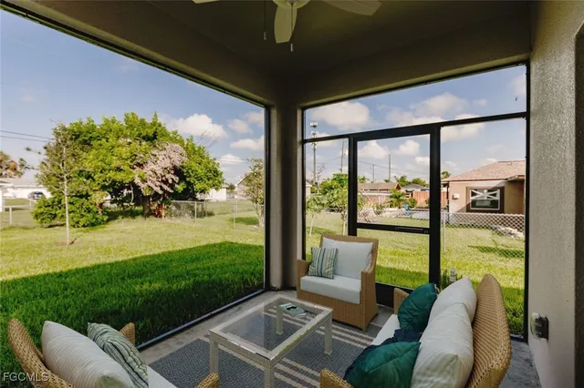 a view of a porch with furniture and garden