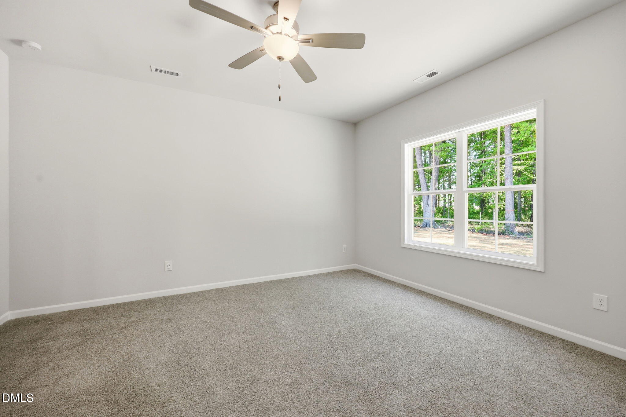 191 Nectar Lane Bunnlevel, NC 28323 - Photo 22 of 35 an empty room with a window and a fan