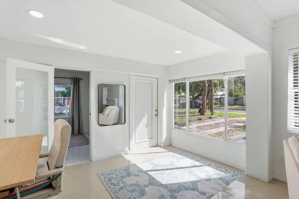 a living room with furniture and a window