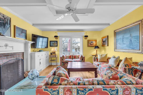 a living room with furniture fireplace and a table