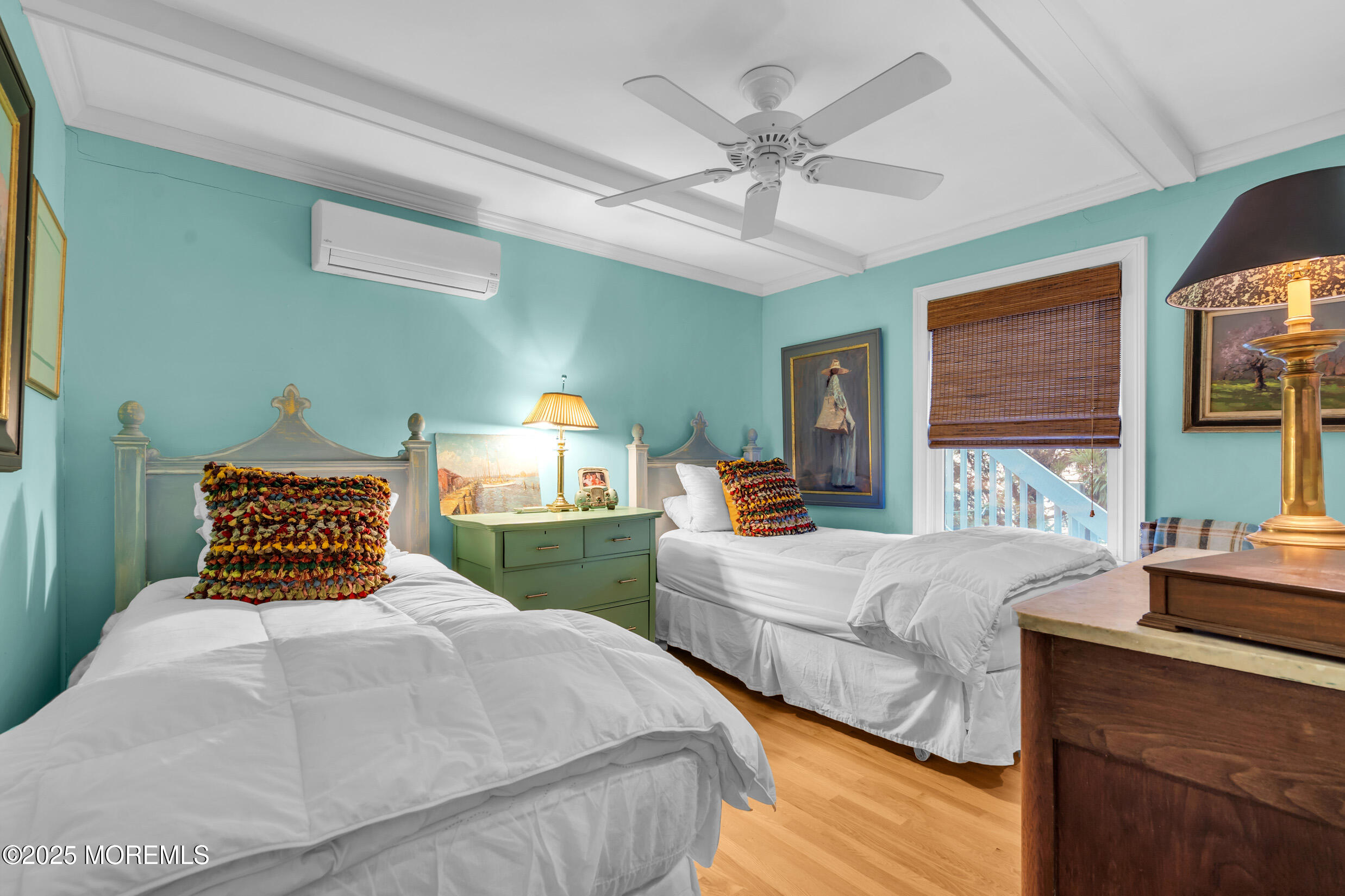 149 Highway 35 Mantoloking, NJ 08738 - Photo 19 of 29 a bedroom with a large bed and a chandelier