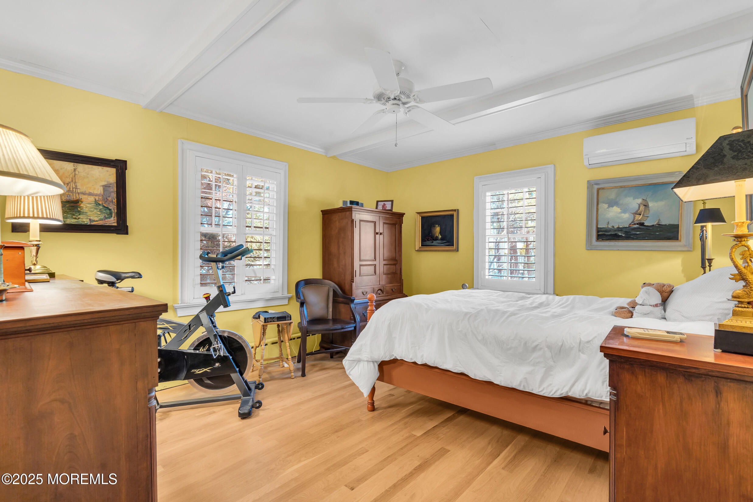 149 Highway 35 Mantoloking, NJ 08738 - Photo 20 of 29 a bedroom with a bed a table and windows