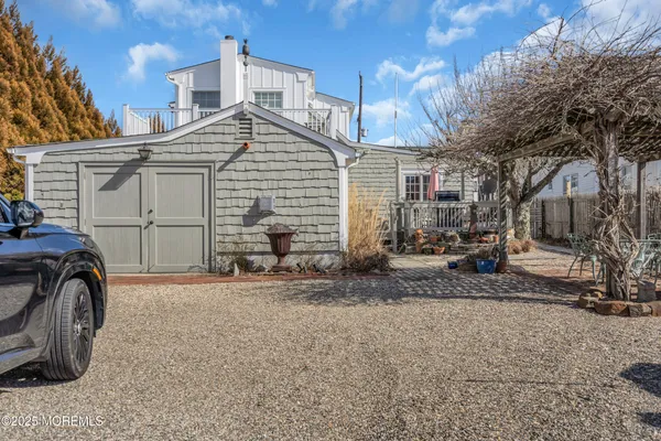 a view of a car park in front of house
