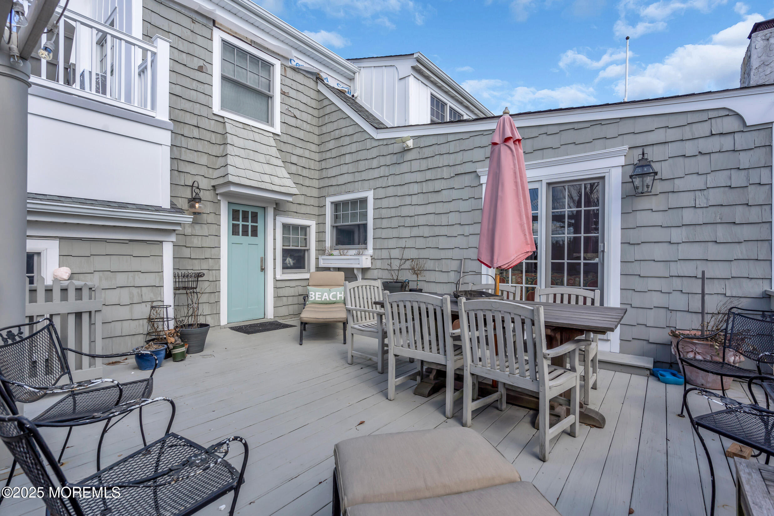 149 Highway 35 Mantoloking, NJ 08738 - Photo 26 of 29 a view of a patio with a table and chairs