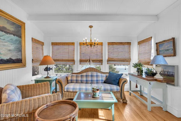 a living room with furniture fireplace and window