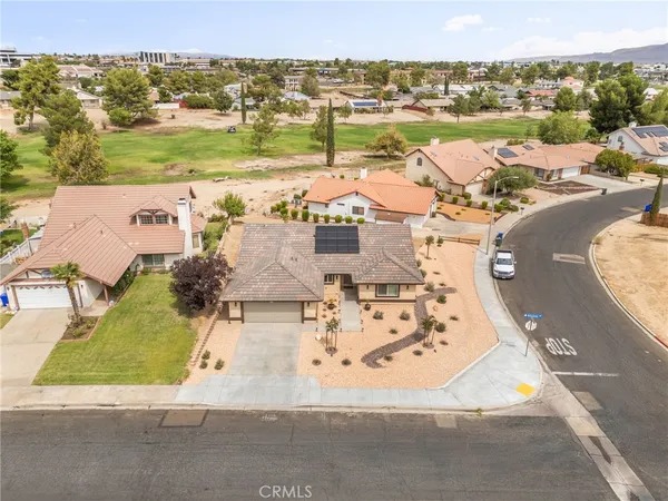 an aerial view of a house with a ocean view