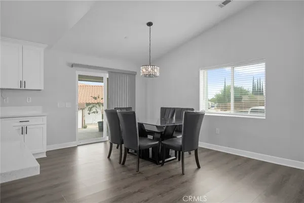 a dining room with furniture window wooden floor