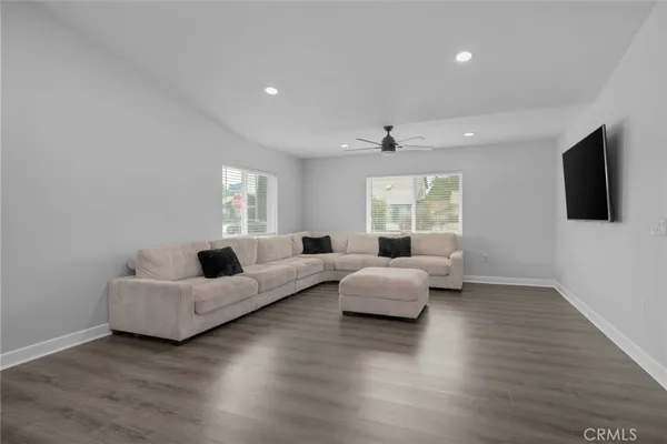 a living room with furniture window and flat screen tv