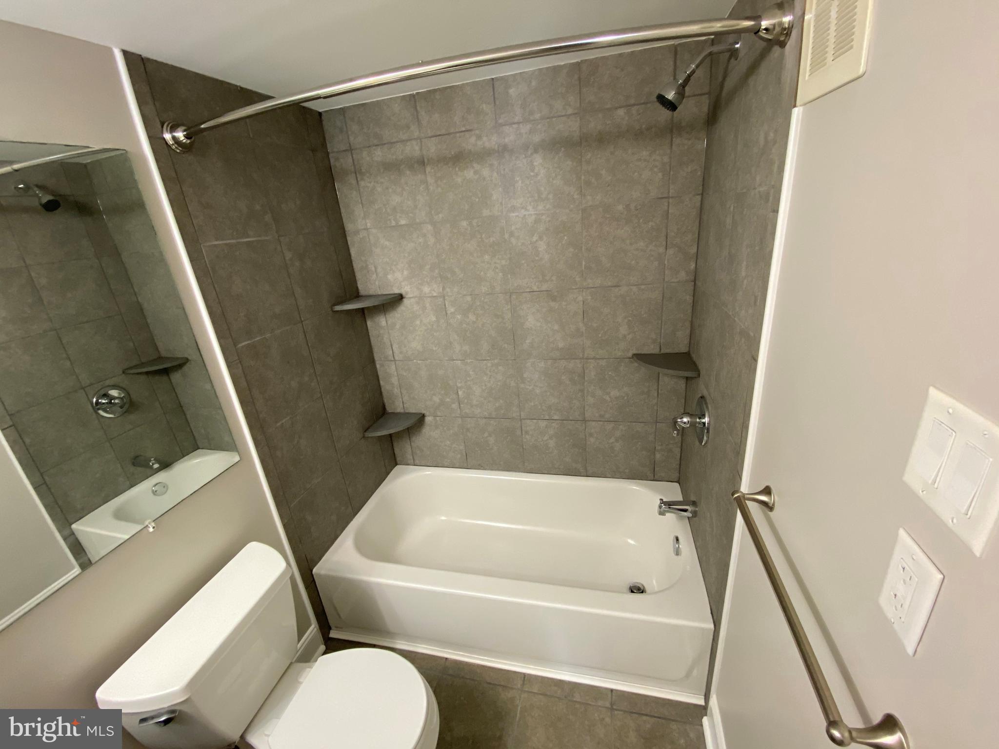1155 York Rd., Unit G13 Warminster, PA 18974 - Photo 11 of 13 a bathroom with a tub and a shower