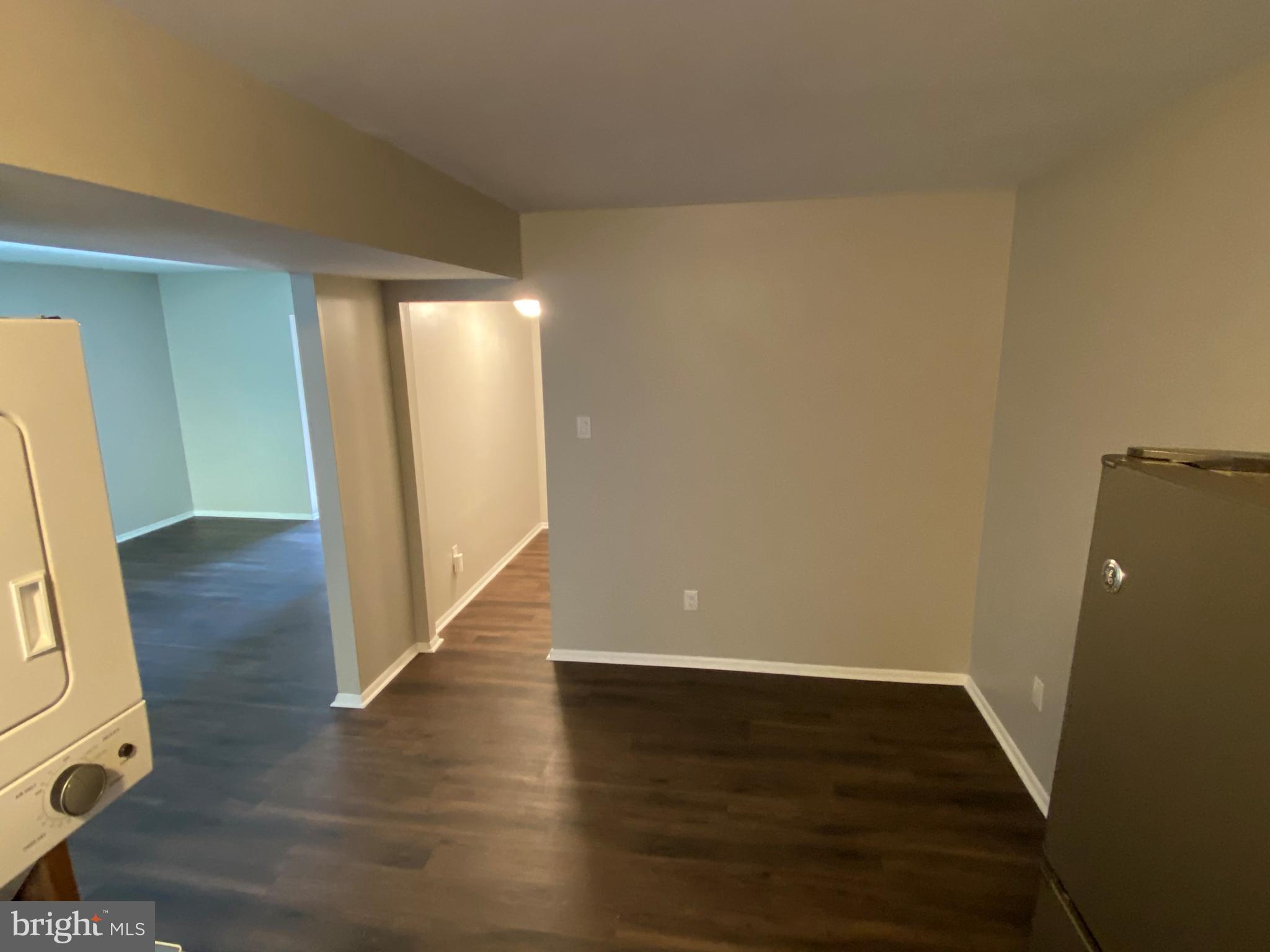 1155 York Rd., Unit G13 Warminster, PA 18974 - Photo 3 of 13 a view of an empty room with wooden floor and a window