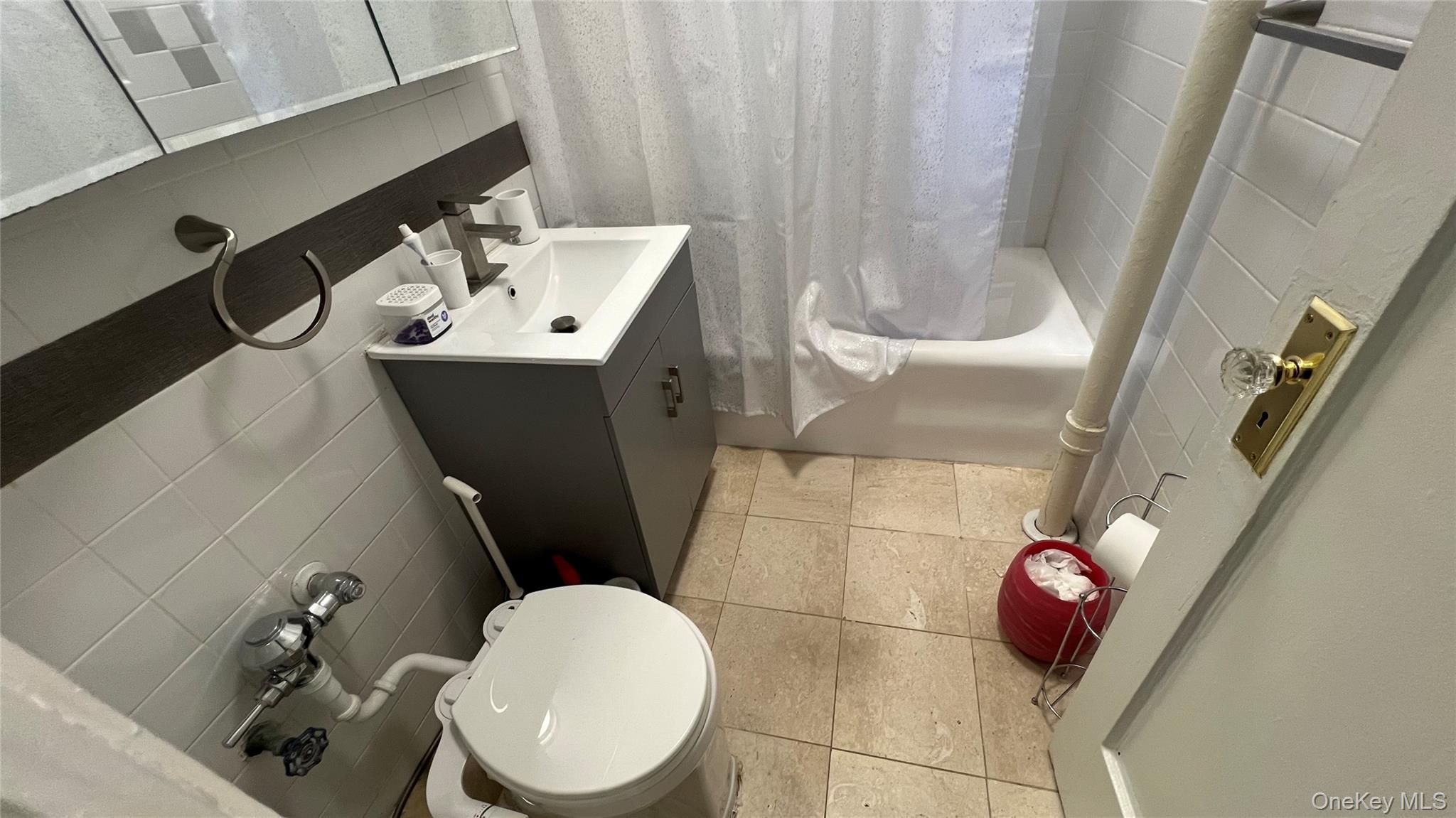 45-20 43rd Street, Unit 2C Queens, NY 11104 - Photo 5 of 14 a bathroom with a sink toilet and shower
