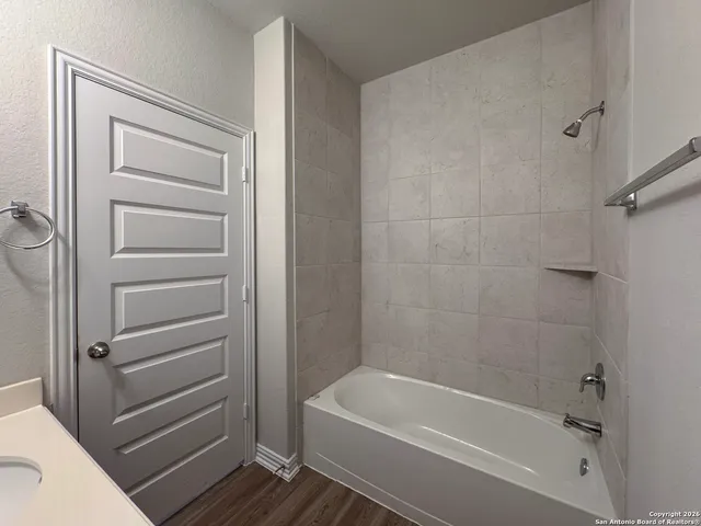 wooden floor in an empty room and a window