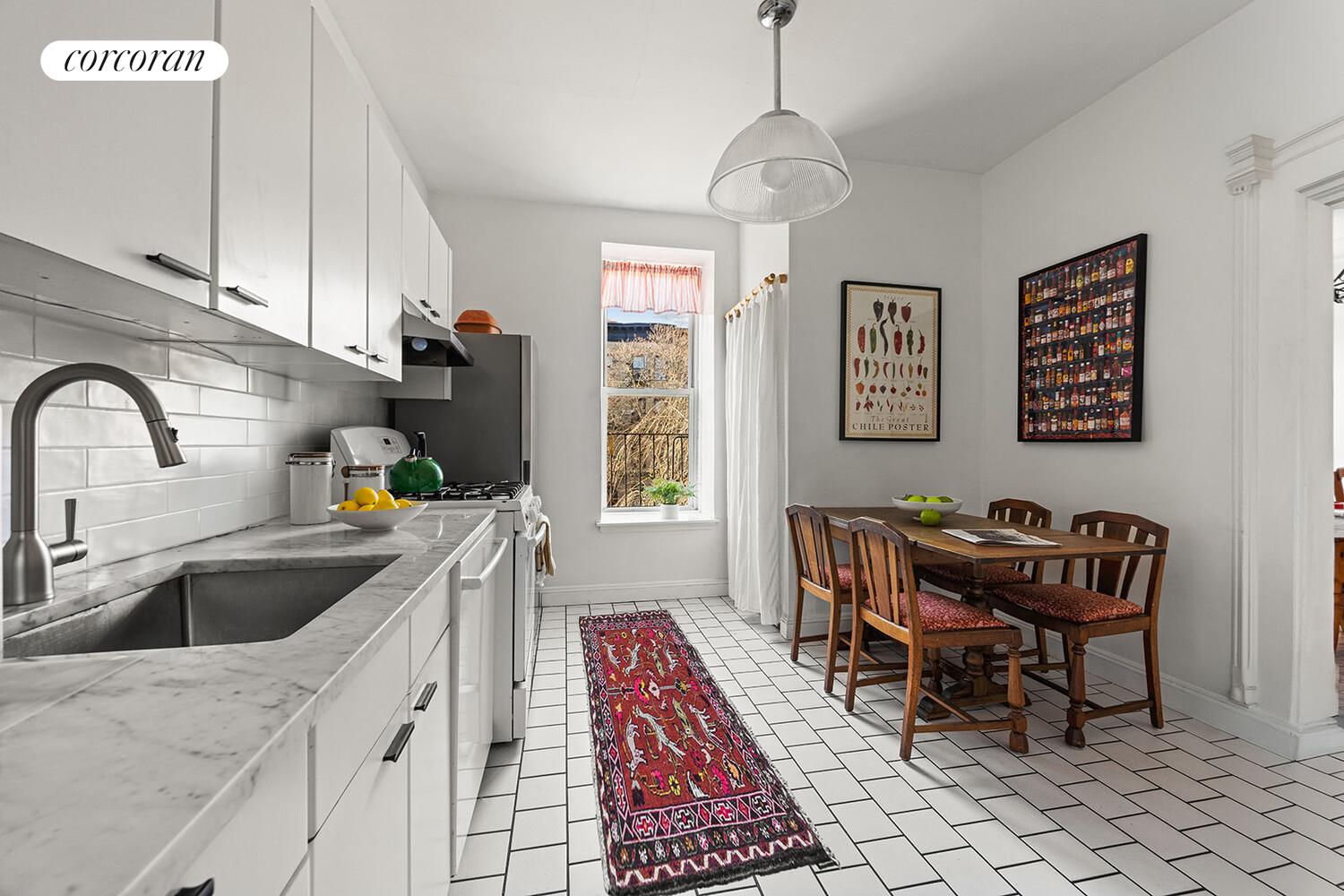433 3rd Street, Unit 3 Brooklyn, NY 11215 - Photo 4 of 12 a kitchen with a dining table and chairs